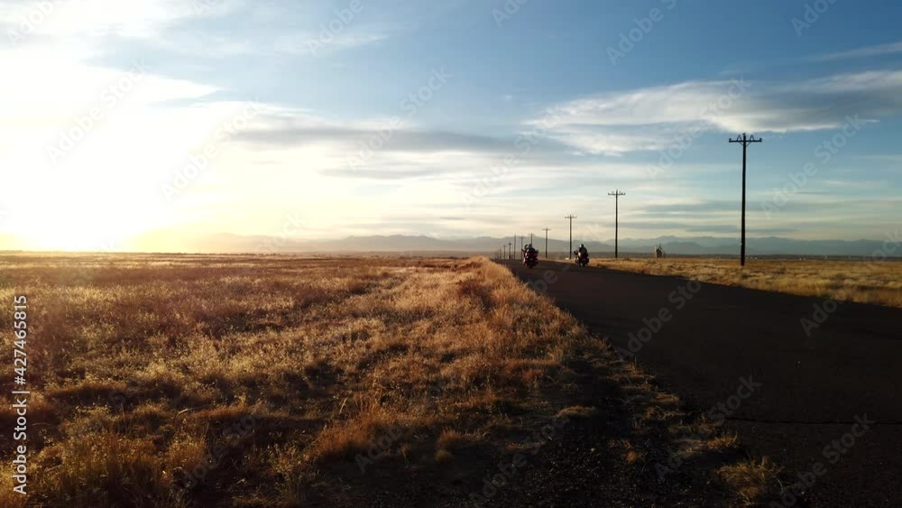 Bikers riding in the countryside of Colorado during a sunny winter day Bikers riding in the countryside of Colorado during a sunny winter day