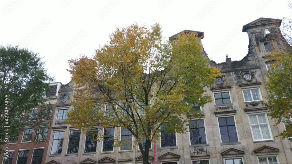 custom made wallpaper toronto digitalAmsterdam, Netherlands - November 01, 2019: view on the city architecture from channel boat at the autumn weather