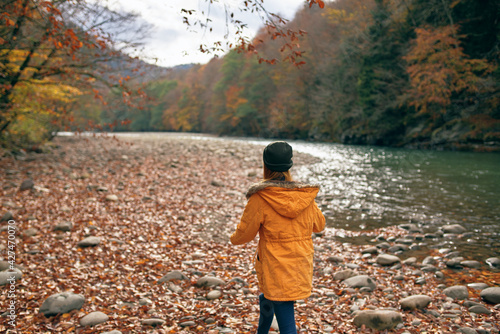 woman hiker near river mountains autumn travel © SHOTPRIME STUDIO
