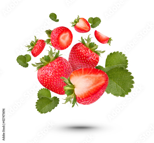 Fresh strawberries with leaves isolated on white background