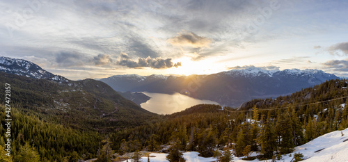 Panoramic View of Canadian Nature Mountain Landscape from Sea to Sky Gondola Summit Viewpoint. Colorful Sunny Spring Sunset. Taken near Squamish, North of Vancouver, BC, Canada.