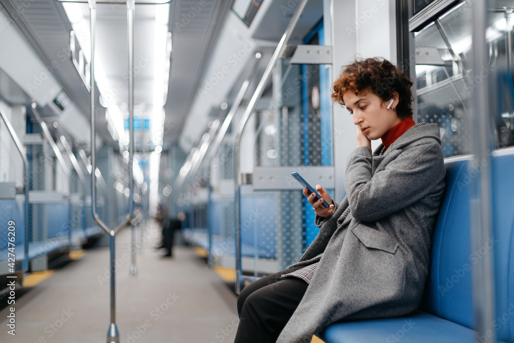 custom made wallpaper toronto digitalwoman using a smartphone while riding the subway .