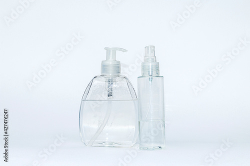 Fighting Coronavirus concept. Hand sanitizer isolated on a white background. Selective focus, copy space and close up. Prevent COVID-19 virus infection and spread.