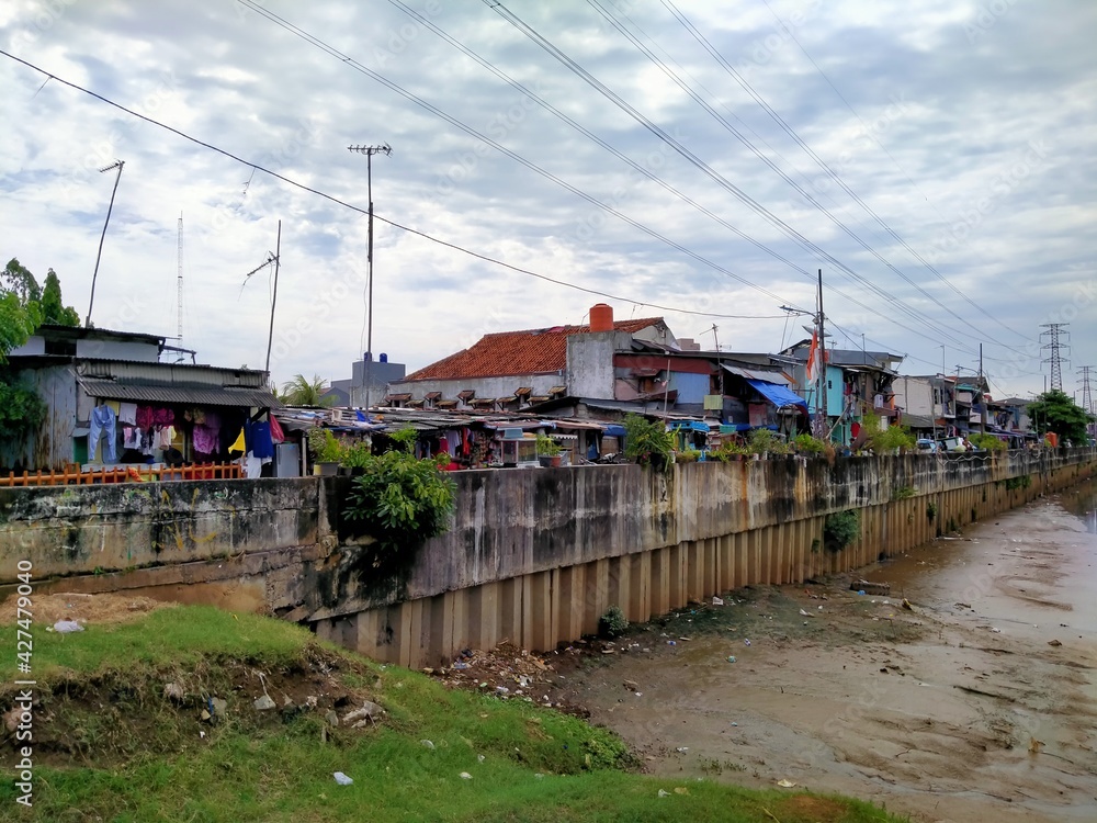 Kali BKB Season City, Jakarta, Indonesia - (4-4-2021) : slum housing in a riverside area