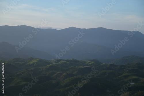 Obraz na płótnie rolling hills coinciding in the sunshine at sunrise