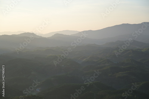 Obraz na płótnie rolling hills coinciding in the sunshine at sunrise