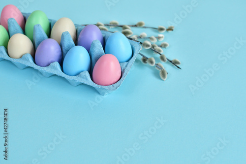 Colorful easter eggs on pastel color background copy space. Easter decorations. Easter background with painted eggs ,