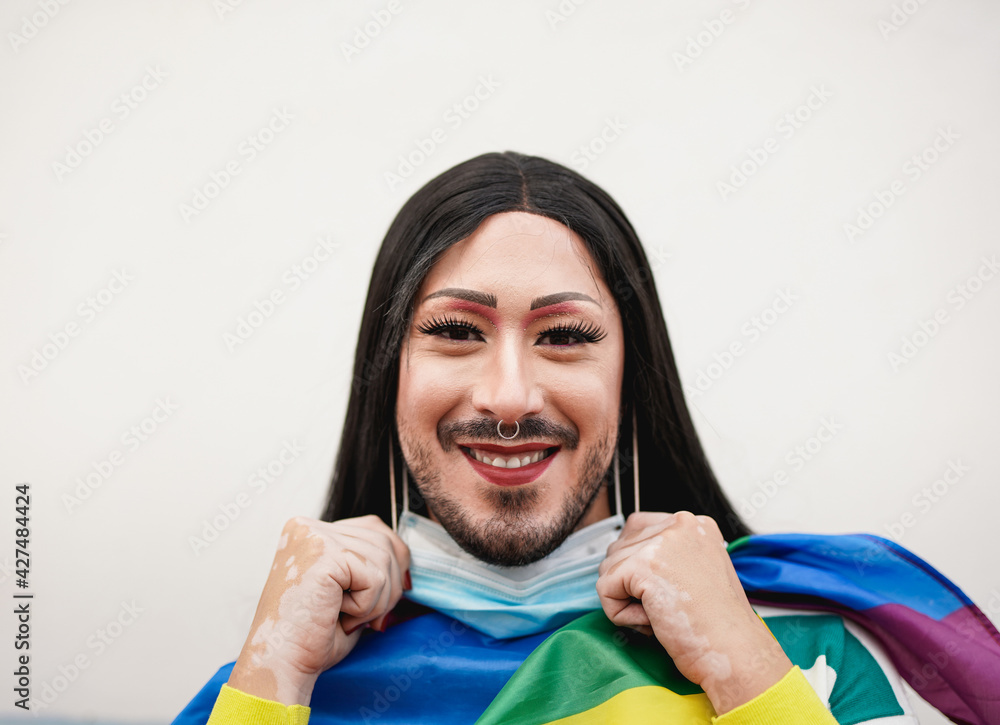 Transgender person at lgbt pride parade remove safety face mask ...