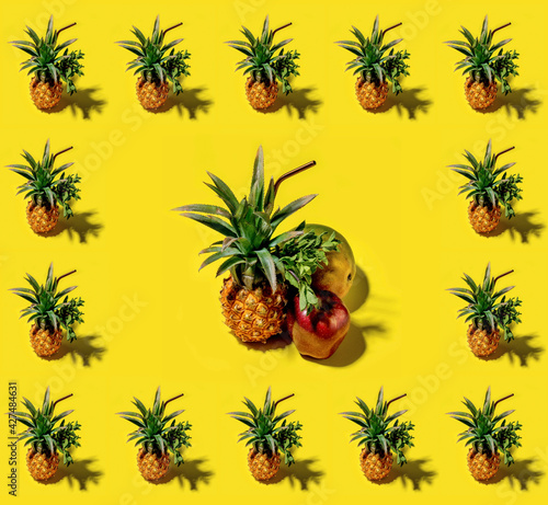 Many pineapples on a solid yellow background pattern