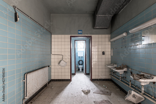 Abandoned toilet room with view of WC