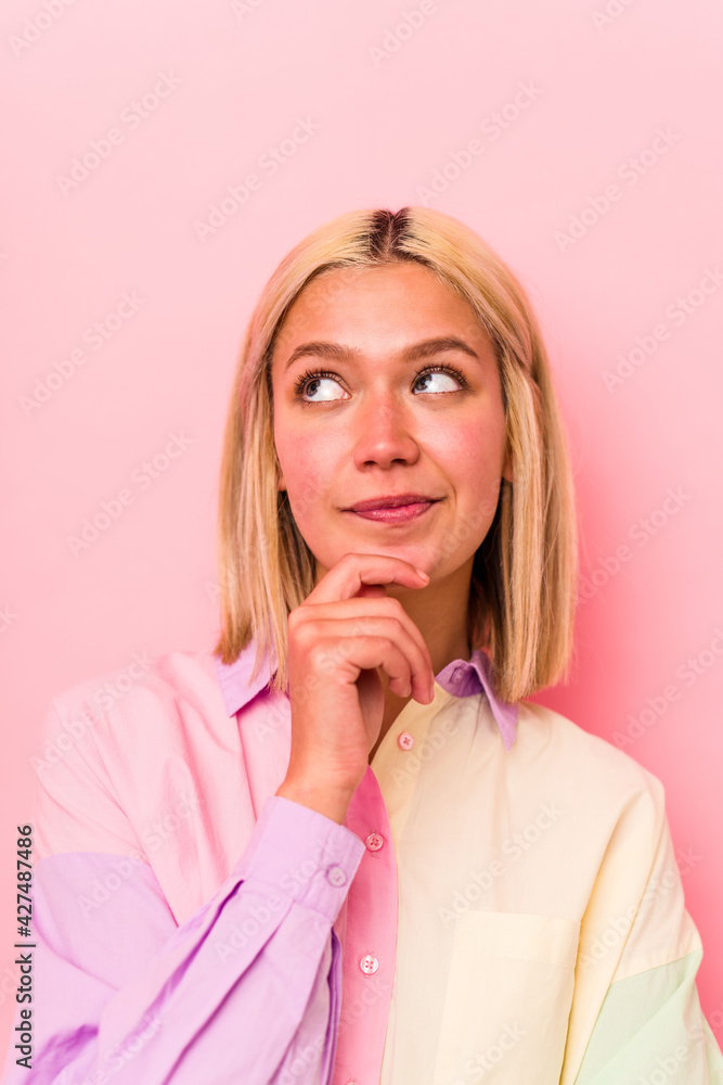 Young caucasian woman face closeup isolated on pink background Young caucasian woman face closeup isolated on pink background