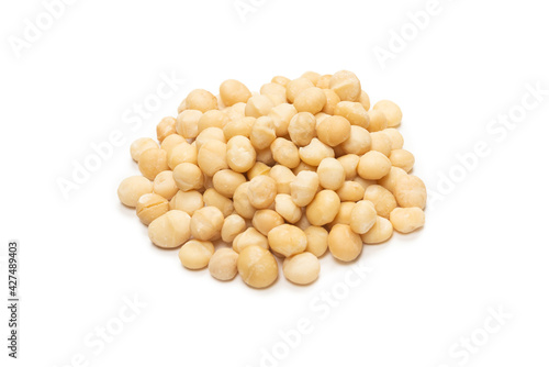 Macadamia nuts isolated on white background.