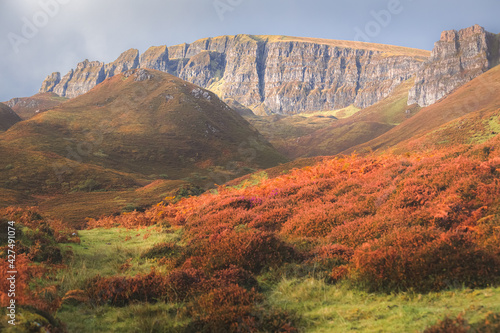 Photos Colourful landscape view of red bracken the rocky cliffs of the Trotternish Ridge at Flodigarry on the  Isle of Skye, Scottish Highlands