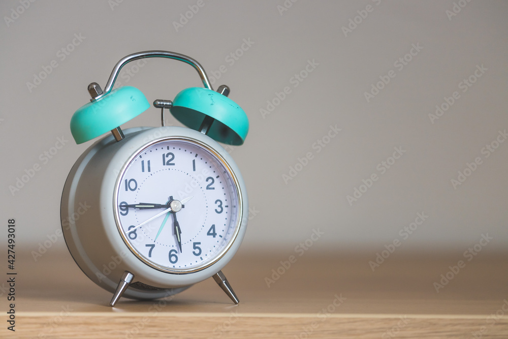 Retro styled white alarm clock, isolated and copy space Retro styled white alarm clock, isolated and copy space