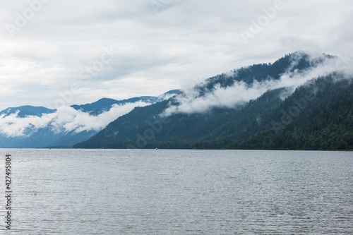 Foggy Teletskoye lake in Altai mountains