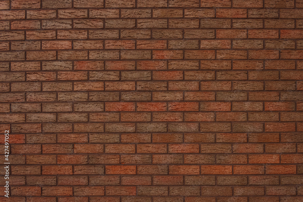 The texture of a decorative brick is brown. Close-up The texture of a decorative brick is brown. Close-up