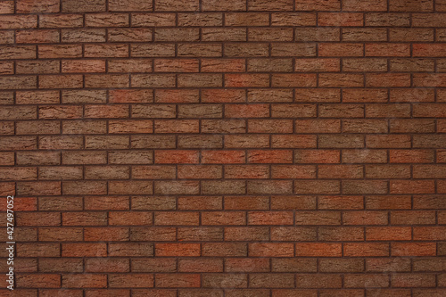 The texture of a decorative brick is brown. Close-up 