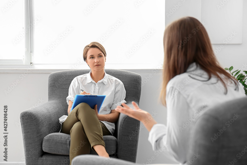 Psychologist working with patient in office