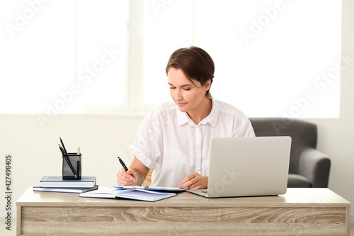 Female psychologist working...