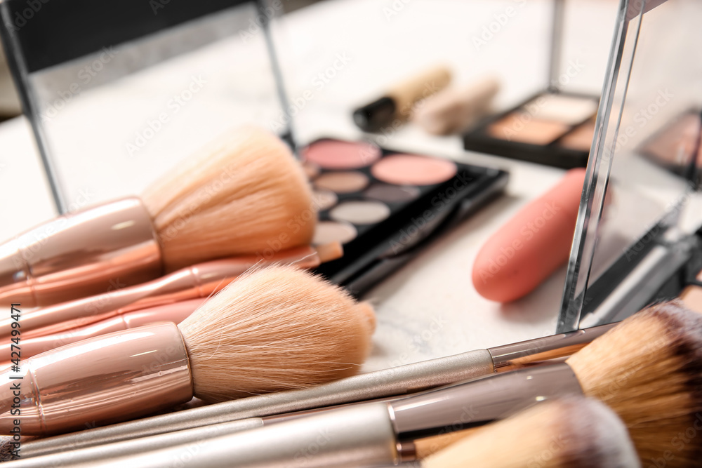 Makeup brushes and cosmetics, closeup Makeup brushes and cosmetics, closeup