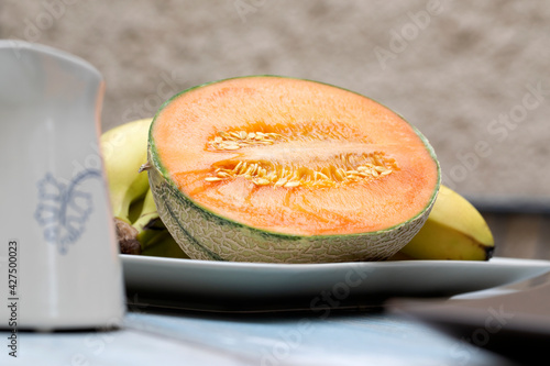 orange melon on a wooden table