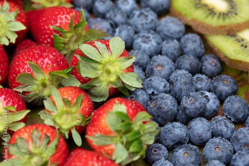Fruits on plate. Wooden surface