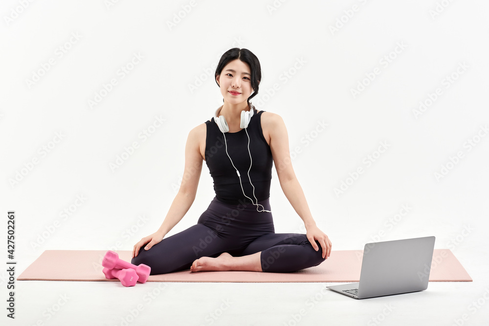 Asia Korean Girl training at white background , watching videos on laptop, and live streaming using gimbal in sns Asia Korean Girl training at white background , watching videos on laptop, and live streaming using gimbal in sns