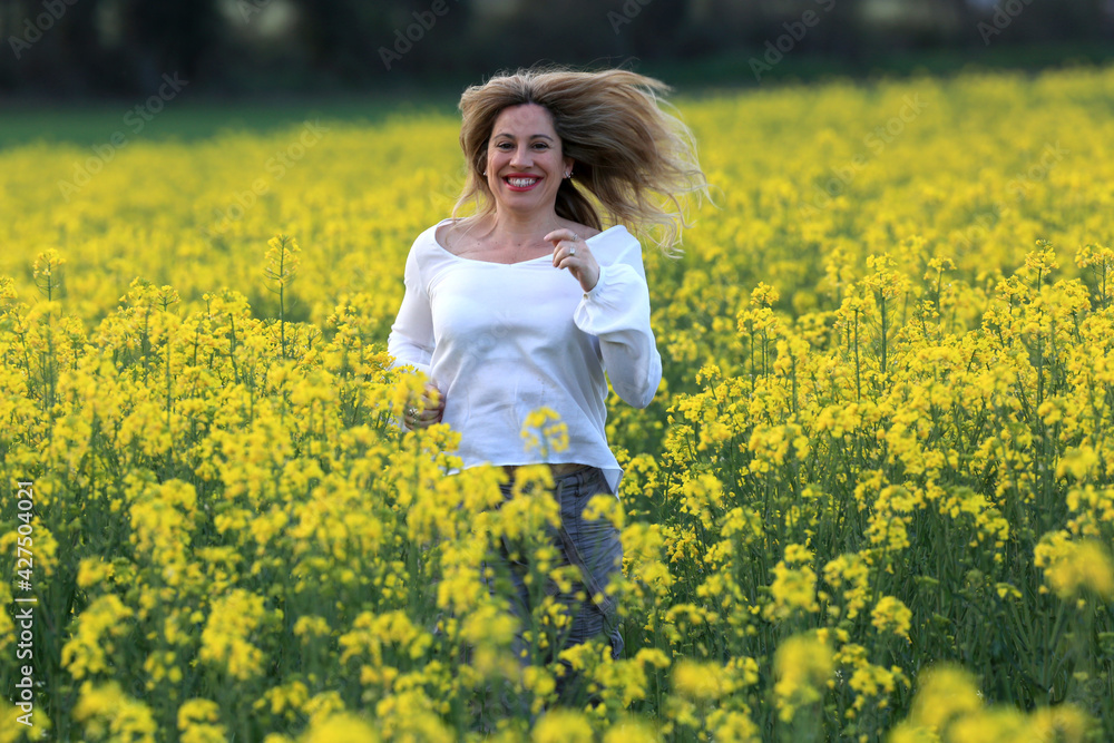woman portrait with yellow flowers field background woman portrait with yellow flowers field background