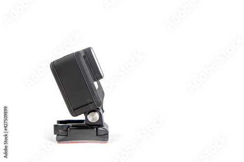 New 4K action camera on a suction mount in black color. Isolated white background