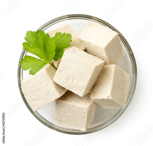 Vászonkép Diced tofu cheese with parsley in a plate on a white background, isolated