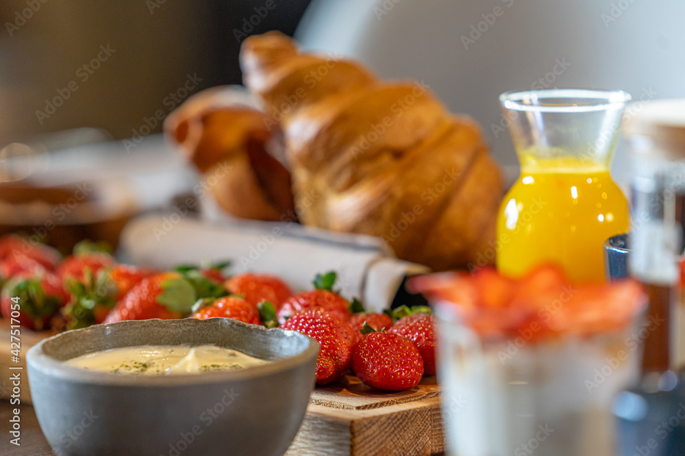 Breakfast served with coffee, orange juice, croissants, cereals and fruits Breakfast served with coffee, orange juice, croissants, cereals and fruits