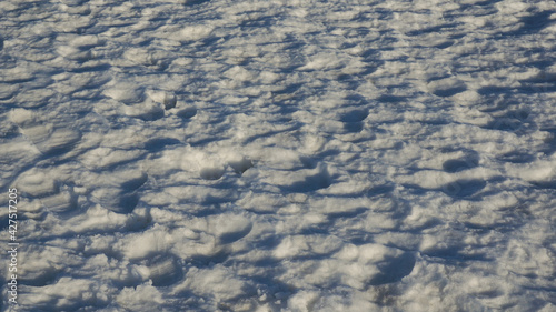 Blue trampled snow. Snow background, winter light blue background.