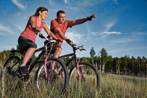 mature couple riding bicycle