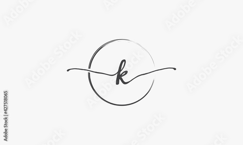 K handwritten logo with circle paint brush design vector.