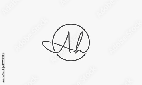 A H  letter logo hand written with circle line.