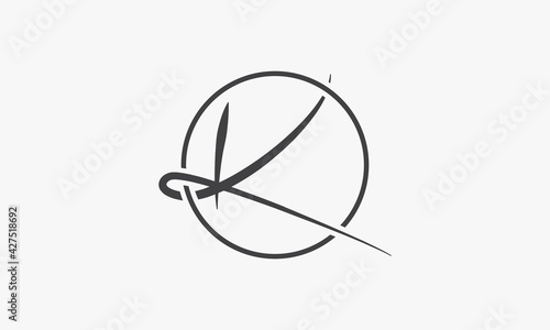 logo letter K handwriting with circle line on white background. photo