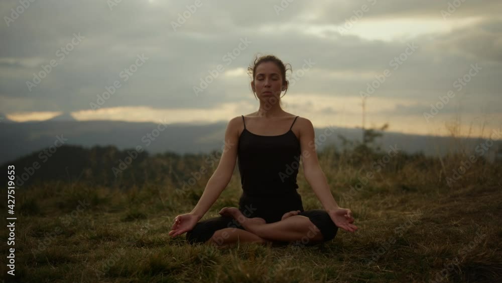 Yoga woman with closed eyes meditating. Fit woman doing namaste yoga pose