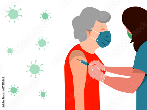 Health personnel or nurse, vaccinate an elderly woman against the coronavirus,