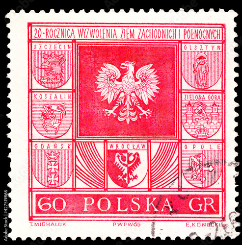  A stamp printed in Poland, 20th anniversary of regaining the Western and Northern Territories, shows Polish Eagle and Town Coats of Arms of Polish cities, series,