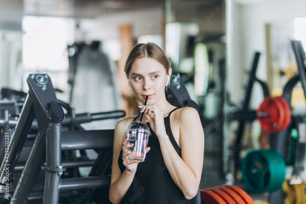 Girl doing exercise in the gym. Sport, healthy lifestyle concept Girl doing exercise in the gym. Sport, healthy lifestyle concept