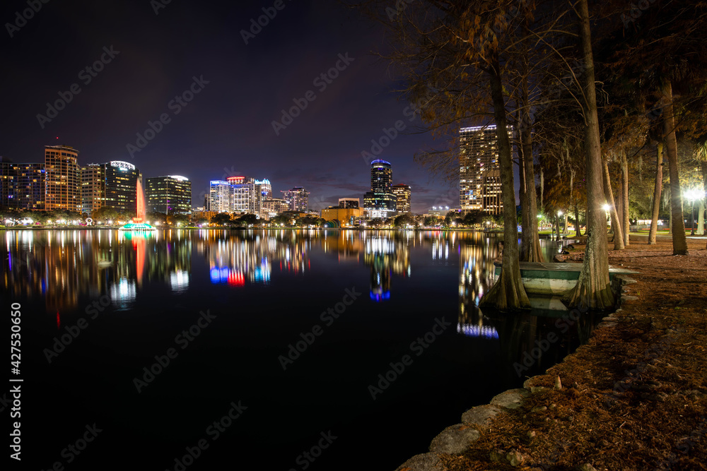 Scenic night view of colorful buildings at Lake Eola Park