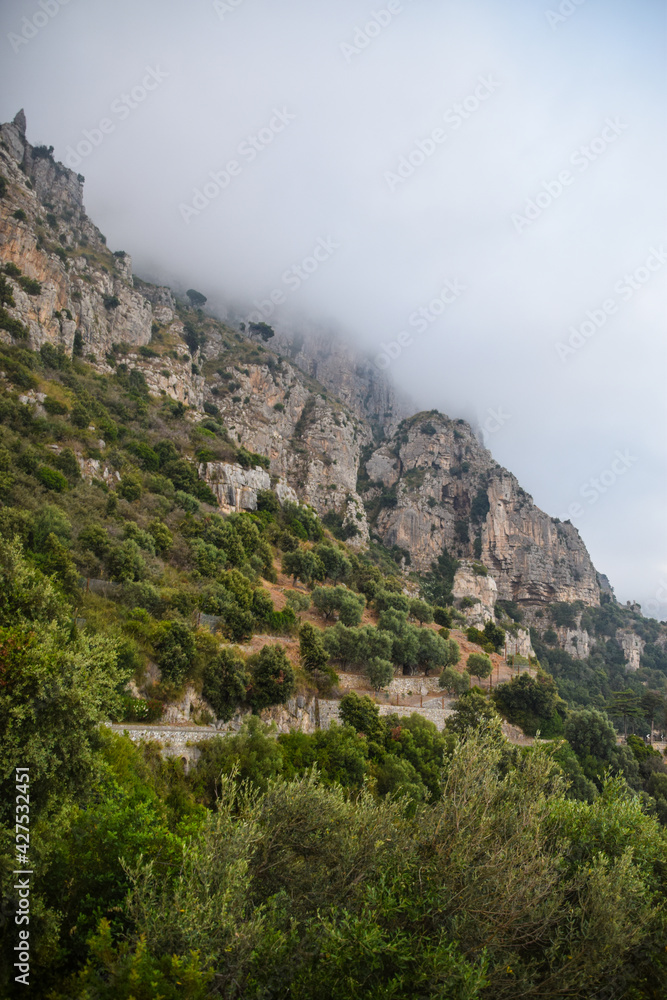 Amalfi coast cliff in fog in Italy