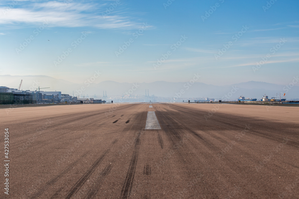 Empty airport. Empty runway against the sky. No travel no fly concept. horizon. freedom .
