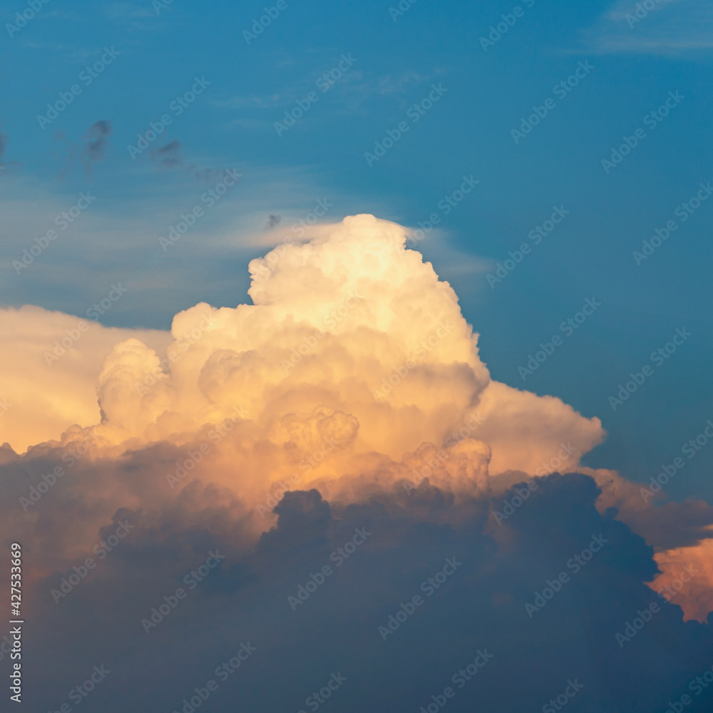 evening sky with beautiful sunlit clouds as a natural background evening sky with beautiful sunlit clouds as a natural background
