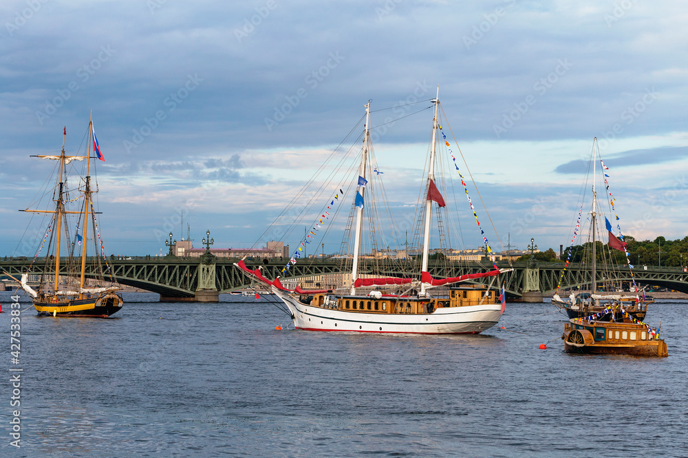 Saint Petersburg, Russia - July 13, 2019 - a group of old sailing ships docked on the Neva River Saint Petersburg, Russia - July 13, 2019 - a group of old sailing ships docked on the Neva River