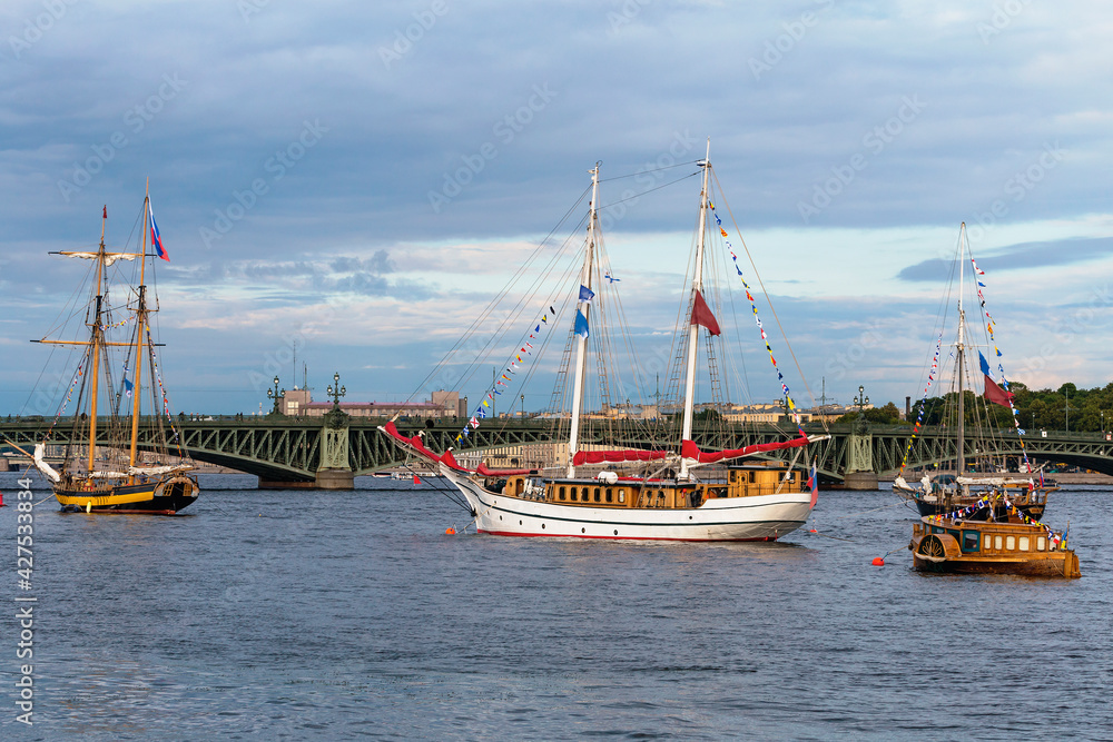 Saint Petersburg, Russia - July 13, 2019 - a group of old sailing ships docked on the Neva River