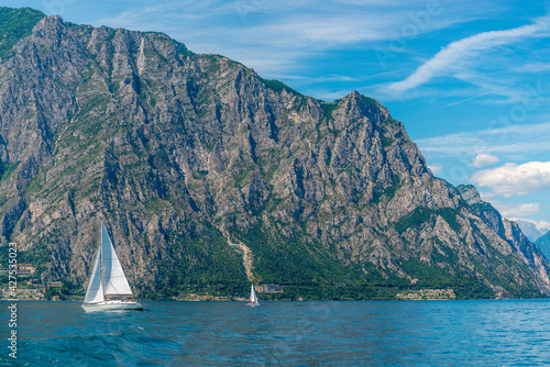 Beautiful peaceful lake Garda, Italy. Sailing boat.