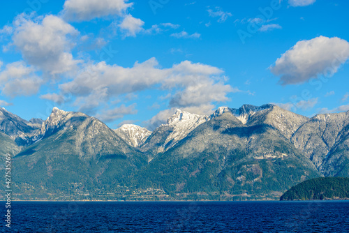 Fantastic view over ocean  snow mountain and rocks at Sechelt inlet in Vancouver  Canada.