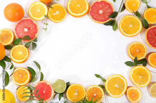 Fresh summer tropical fruits on bright sunny table with place for text  detox diet and weight loss concept. Top view  healthy and natural food  source of vitamin C  selective focus