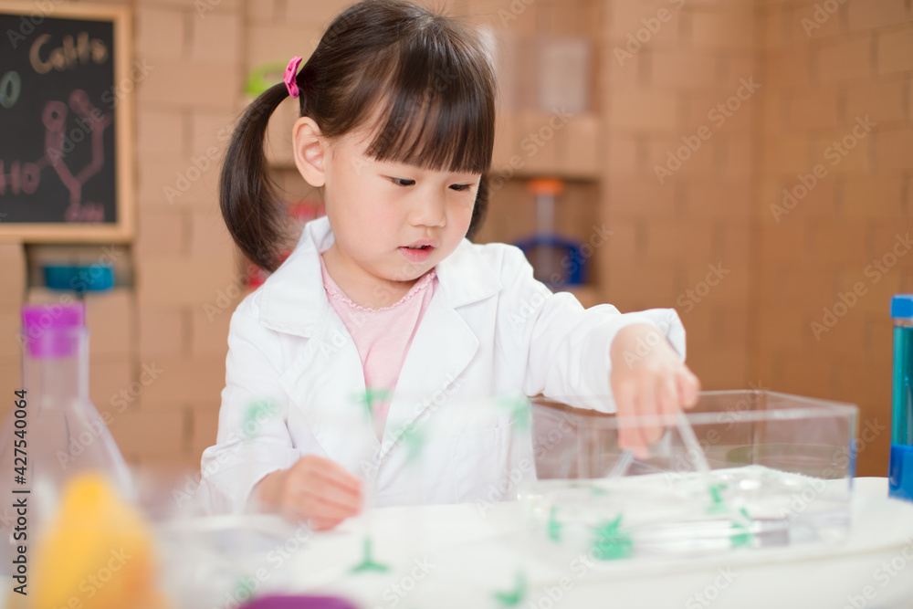 young girl plays science experiment for home schooling young girl plays science experiment for home schooling